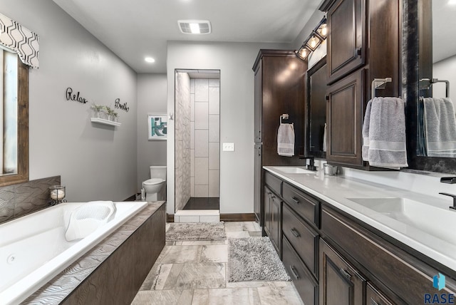 full bathroom with independent shower and bath, vanity, and toilet