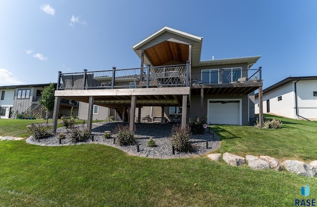 back of property featuring a wooden deck, a garage, and a yard