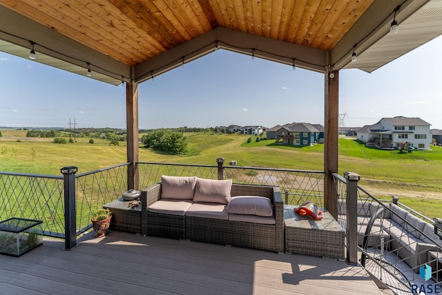 wooden deck with an outdoor living space