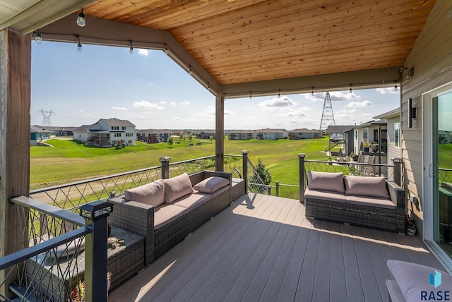 wooden terrace with an outdoor hangout area