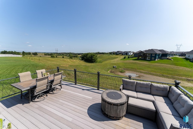 wooden terrace with an outdoor living space