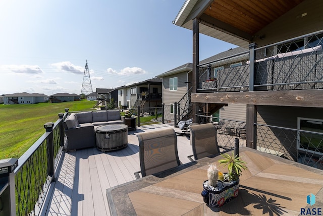 wooden terrace featuring an outdoor living space