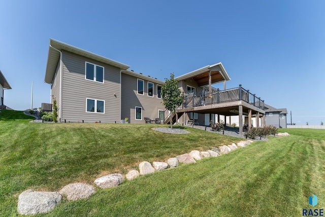 back of property featuring cooling unit, a deck, and a lawn