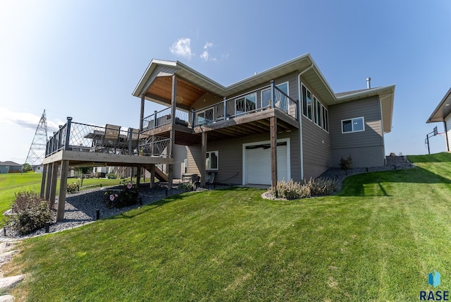 back of property with a garage, a wooden deck, and a lawn