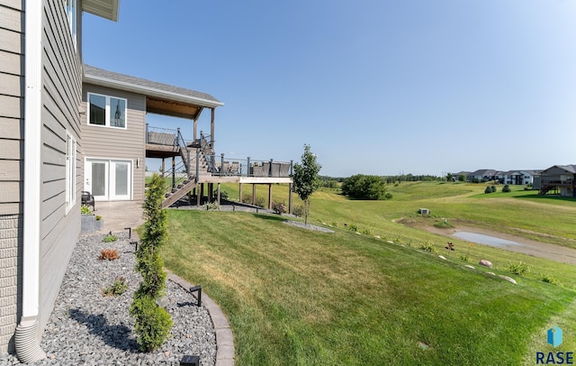 view of yard with a wooden deck