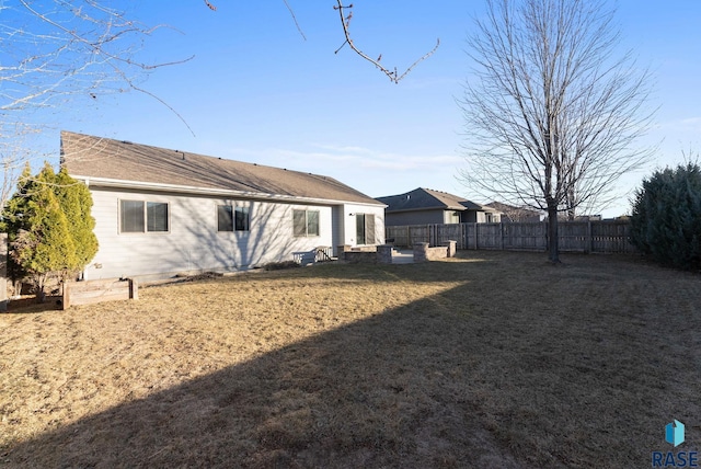 back of house featuring a yard