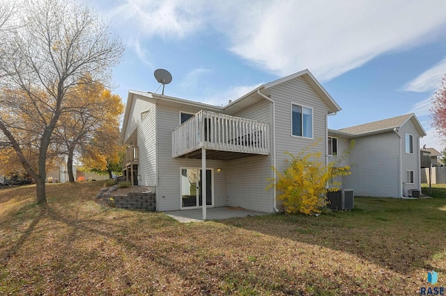 back of property featuring cooling unit, a patio, and a lawn