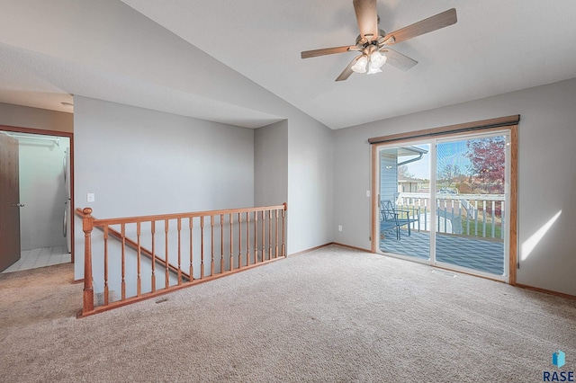 spare room with lofted ceiling, carpet flooring, and ceiling fan