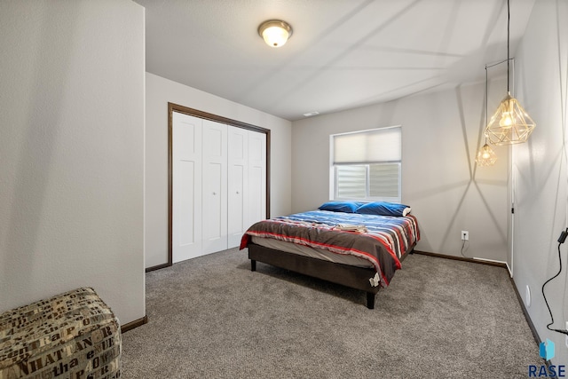 bedroom featuring a closet and carpet flooring