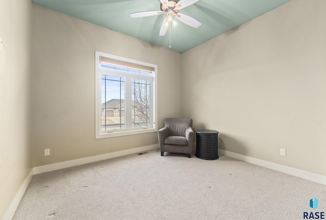 sitting room with carpet flooring and ceiling fan