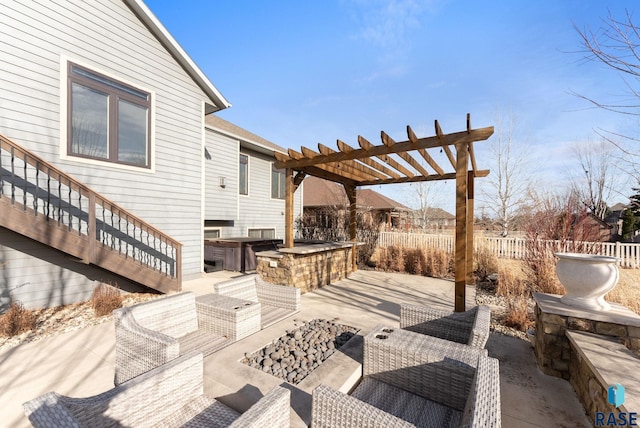 wooden terrace with a pergola, a patio area, and an outdoor living space with a fire pit