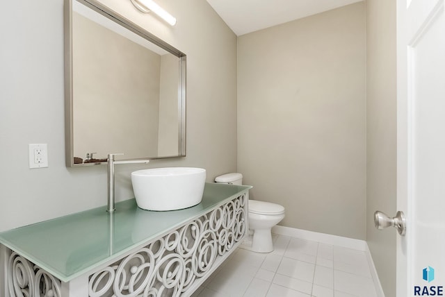 bathroom with tile patterned flooring and toilet