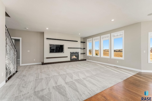 unfurnished living room with light wood-type flooring