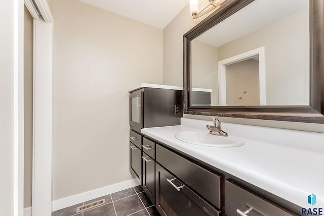 bathroom with vanity and tile patterned flooring