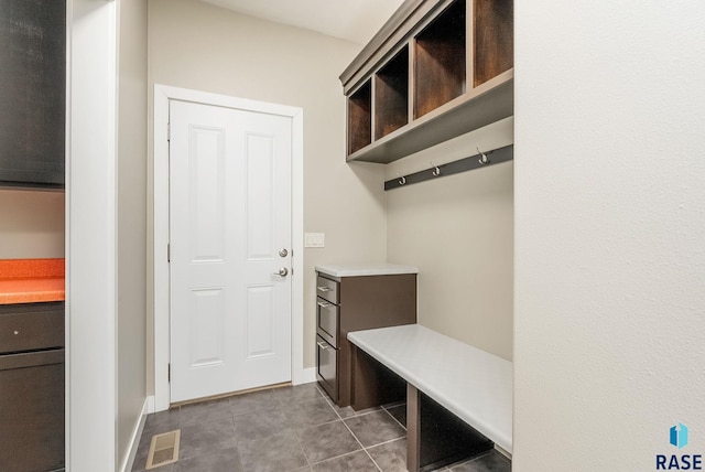 mudroom with tile patterned floors