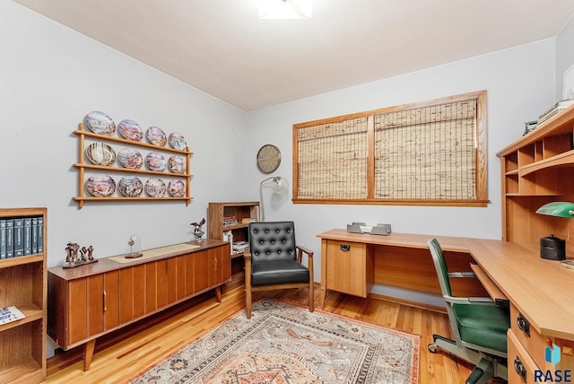 office space with light wood-type flooring