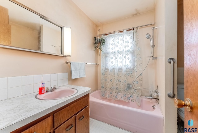 bathroom featuring vanity, shower / tub combo, and backsplash