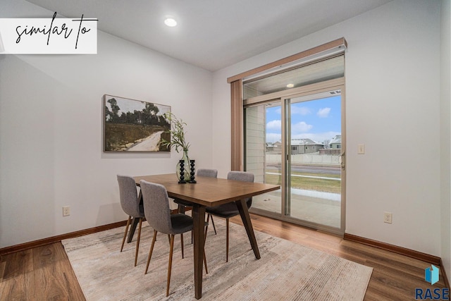 dining space featuring wood-type flooring