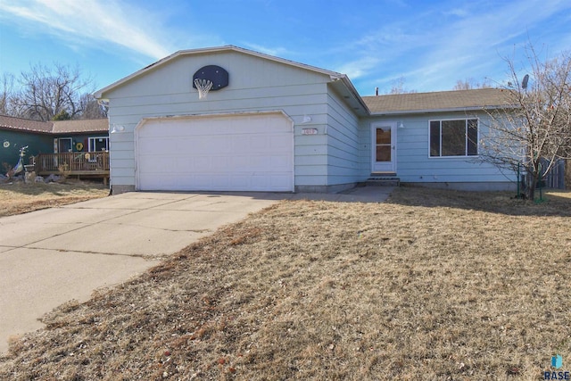 ranch-style house with a garage and a front yard