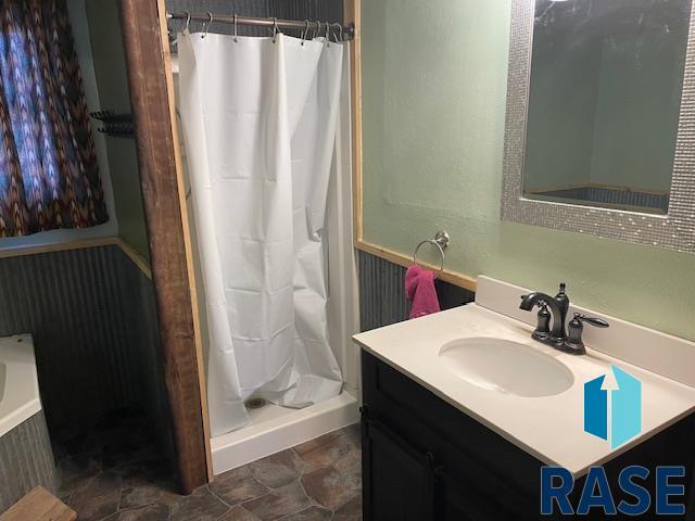 bathroom featuring vanity and walk in shower