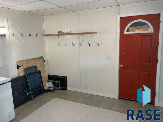 mudroom featuring parquet floors and a paneled ceiling