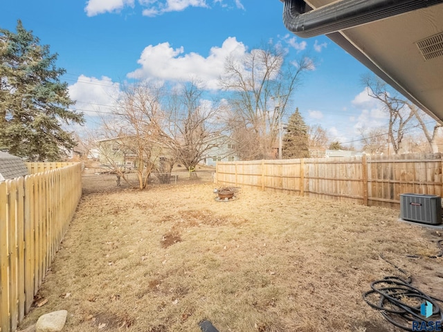 view of yard with central AC unit