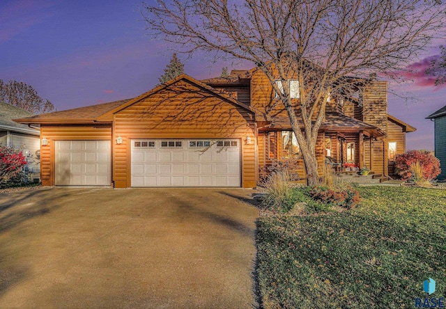 view of front of home featuring a garage and a porch