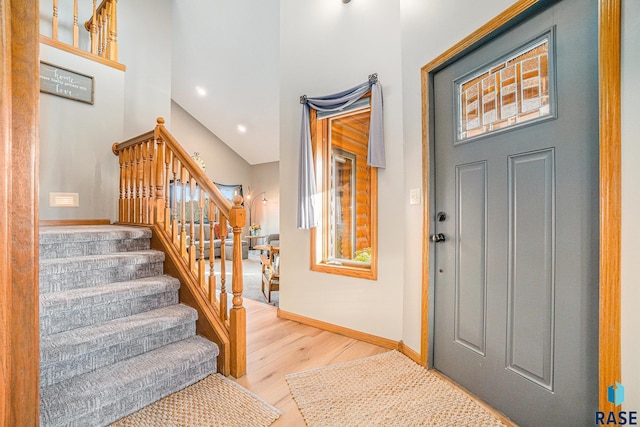 foyer entrance with light hardwood / wood-style floors