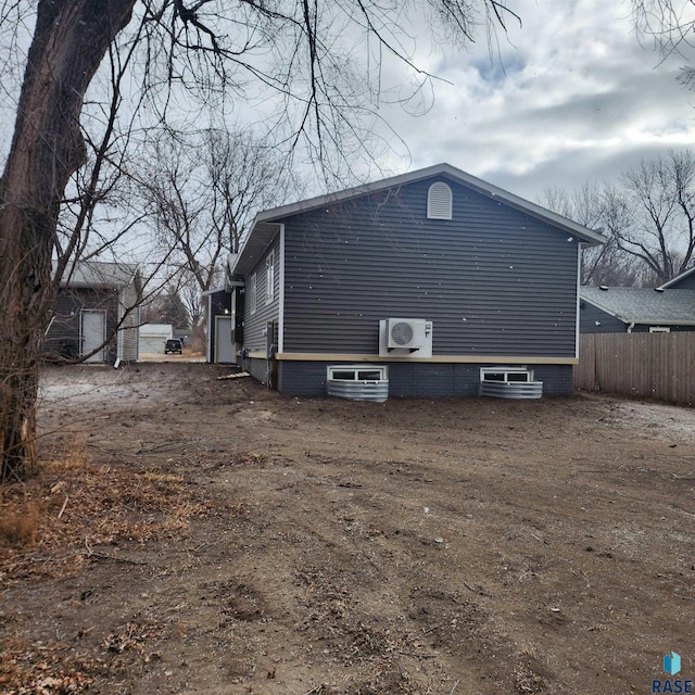 view of side of property with ac unit