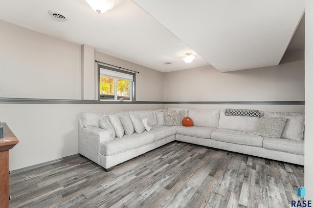 unfurnished living room featuring hardwood / wood-style flooring