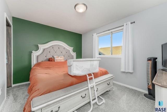 bedroom featuring light carpet