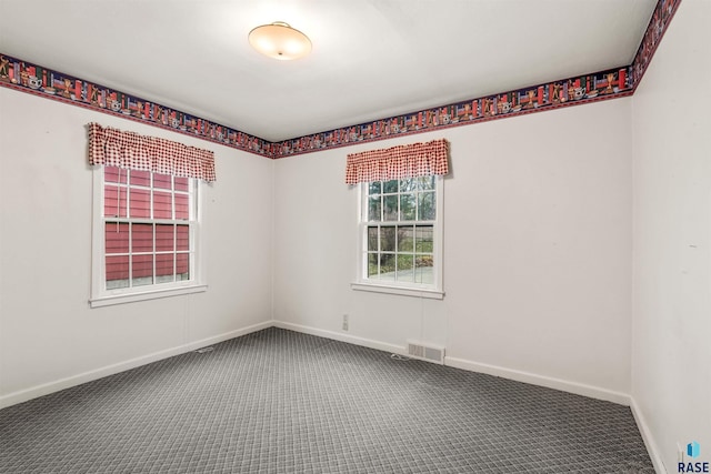 empty room with carpet flooring