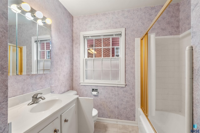 full bathroom with shower / washtub combination, vanity, tile patterned floors, and toilet