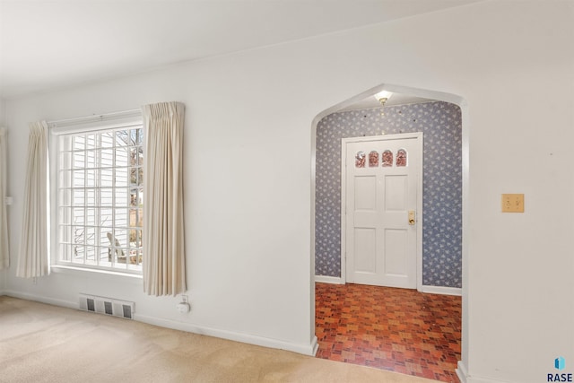 entryway featuring carpet flooring