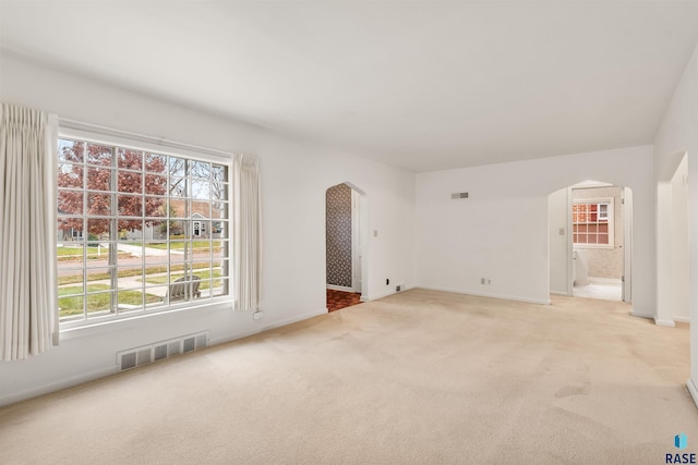 empty room featuring light carpet