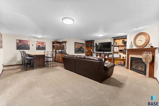 carpeted living room with indoor bar