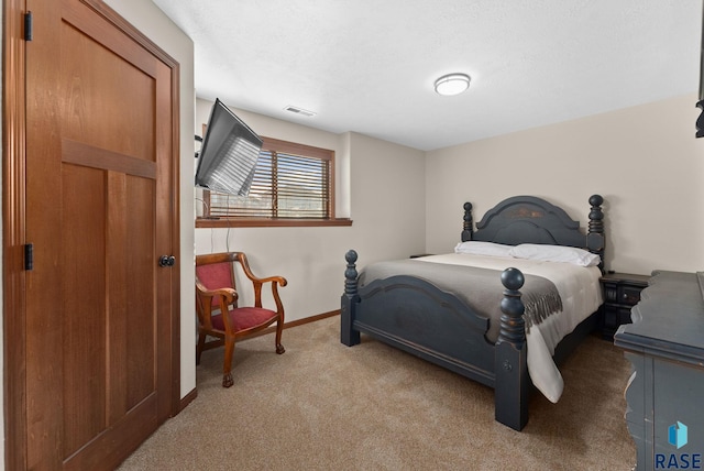 bedroom with light colored carpet