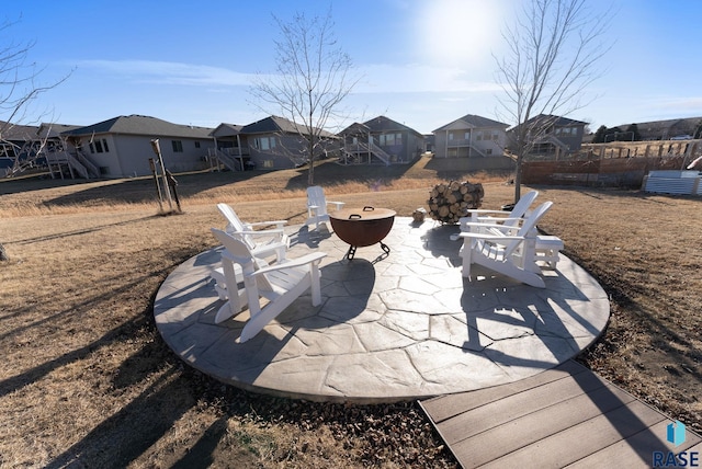 view of patio with a fire pit