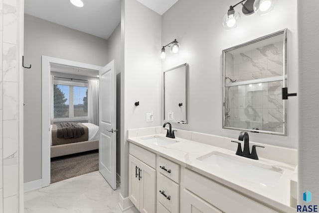 bathroom with vanity and a shower with shower door