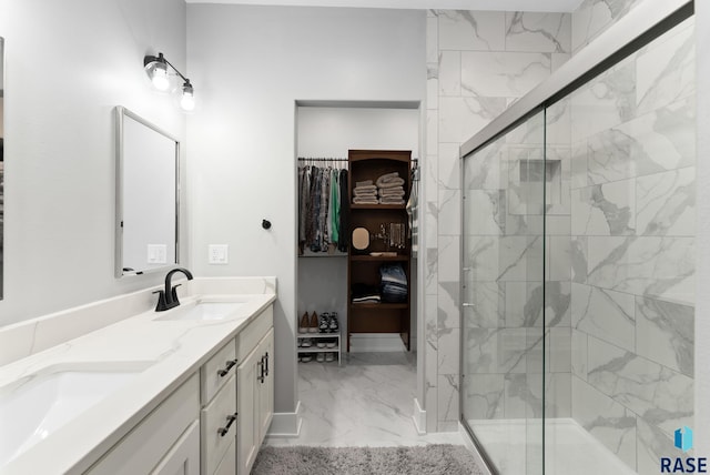 bathroom featuring vanity and a shower with shower door