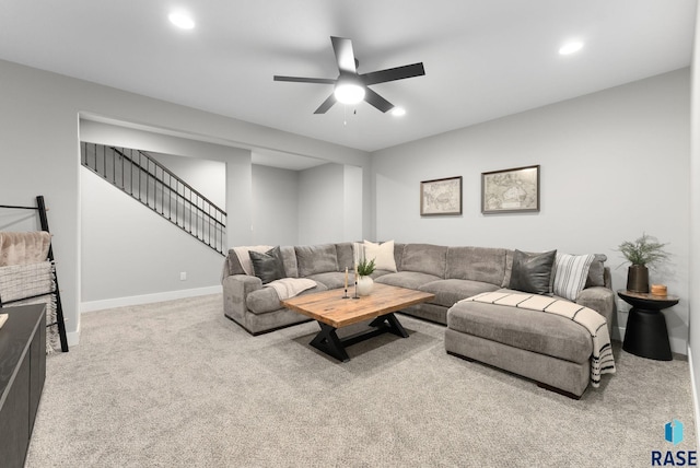 living room with light carpet and ceiling fan