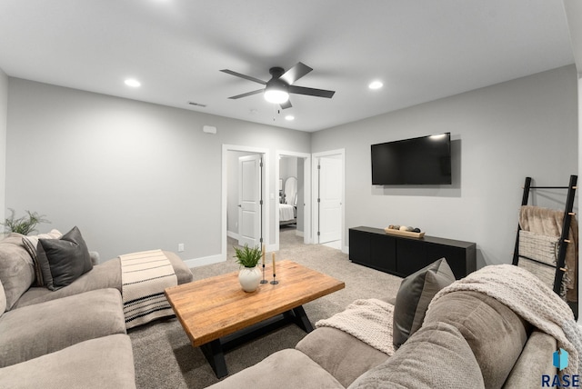 living room with ceiling fan and carpet flooring