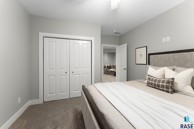 carpeted bedroom with a closet