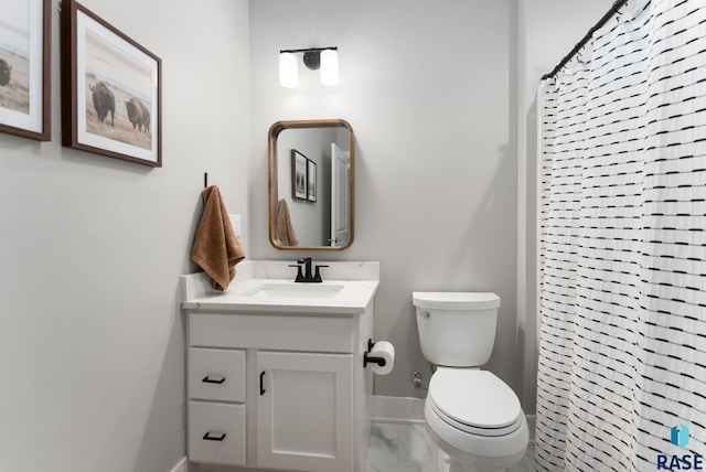 bathroom with vanity, toilet, and curtained shower