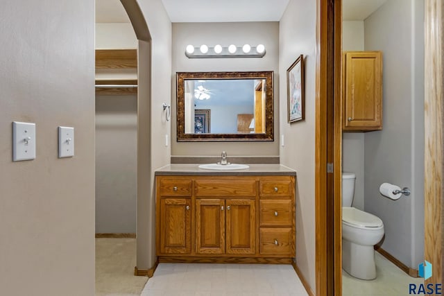 bathroom with vanity and toilet