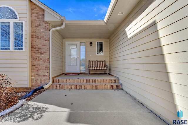 property entrance with a patio area