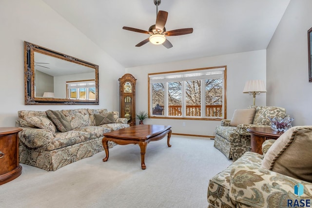 carpeted living room with lofted ceiling and ceiling fan