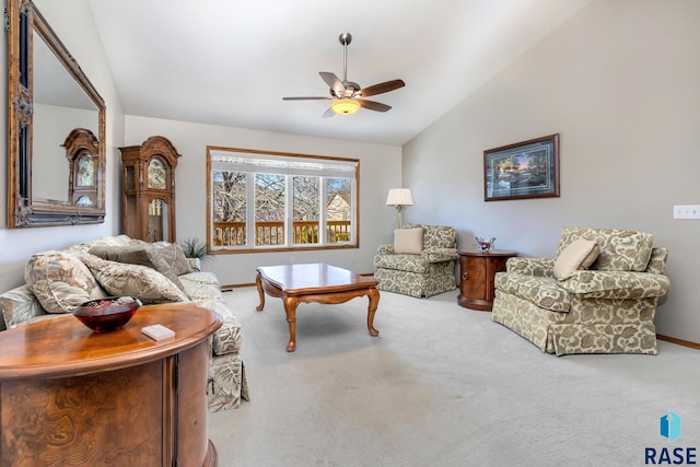 carpeted living room with vaulted ceiling and ceiling fan