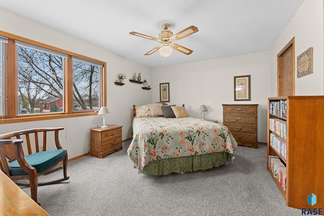 bedroom with ceiling fan and carpet flooring