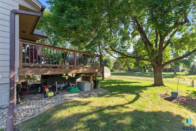 view of yard with a wooden deck